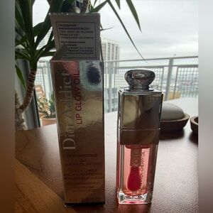 Dior Addict Lip Glow Oil with Silver Cap and Pink Tint